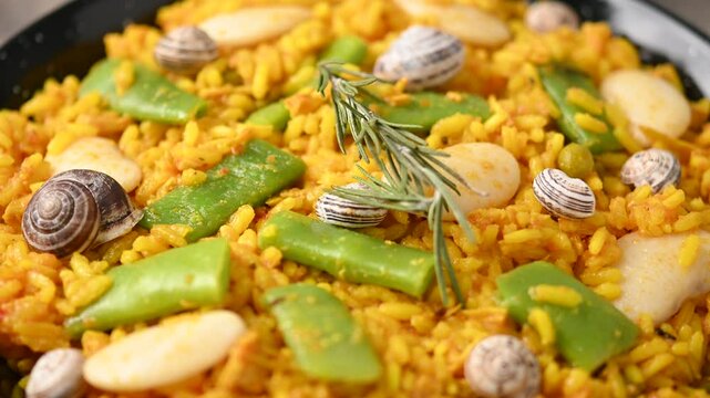 Traditional Valencian paella with chicken and rabbit. Close up