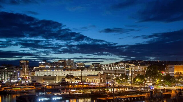 Dynamic Aker Brygge Night Scene Timelapse with Boats and Crowds