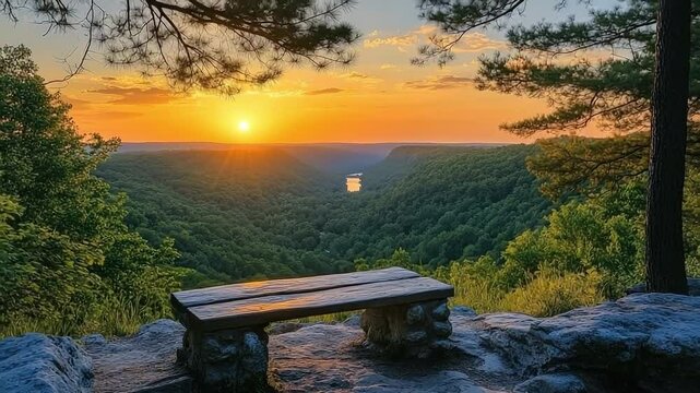 Bench is on a rock overlooking a river. The bench is wooden and has a stone base. The sun is setting in the background, creating a beautiful view