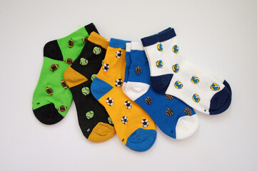 5 Children's Bright Pairs of Socks on a White Background