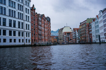 Reflections on a cityscape. Water view of city buildings and river.