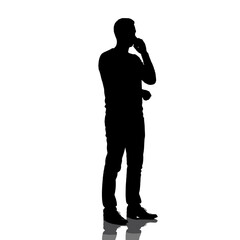 Silhouette of a man thinking while using a cellphone  