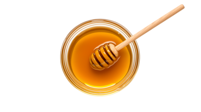 Top view of a glass bowl containing honey with a wooden dipper inside isolated on transparent background	