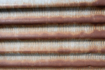 Rusty corrugated metal surface close-up