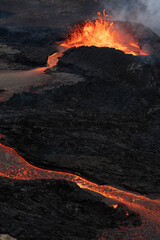 Hot, Glowing Lava Flowing from a Volcano Crater. Volcanic Eruption in Iceland.