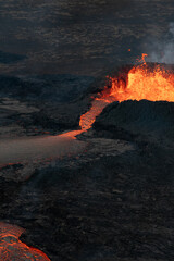 Hot, Glowing Lava Flowing from a Volcano Crater. Volcanic Eruption in Iceland.