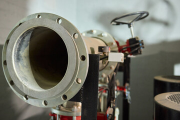 Fototapeta premium An Industrial Pipe Equipped with Valves and Sensors Found in a Mechanical Setting Environment