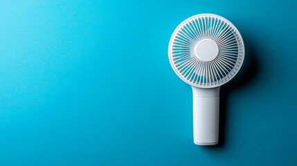 A handheld plastic fan is shown in isolation on a white background with a white clipping path