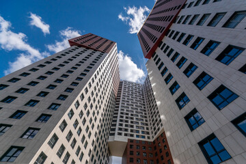 Two towering buildings dominate the urban skyline, showcasing innovative architecture.