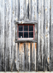 Old weathered wood barn wall, door and window