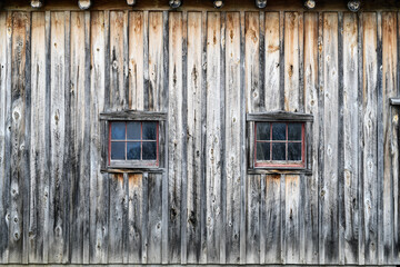 Old weathered wood barn wall, door and window