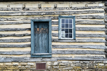 Old weathered wood barn wall, door and window