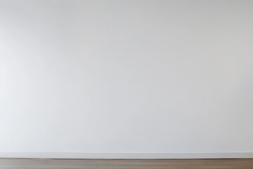 Blank, white wall meets a light brown wooden floor.  A simple, empty interior space, perfect for showcasing decor