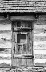 Old weathered wood barn wall, door and window