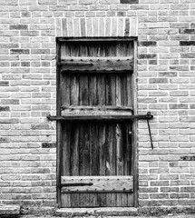 Old weathered wood barn wall, door and window