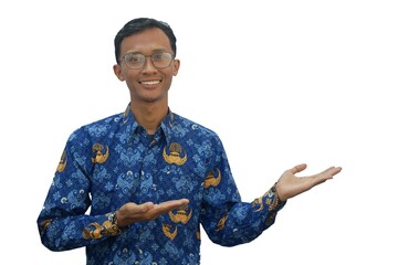 An Asian man wearing an Indonesian civil servant uniform looks at the camera showing a happy...