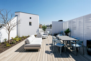 Naklejka premium contemporary rooftop patio with white sofa and blue chairs