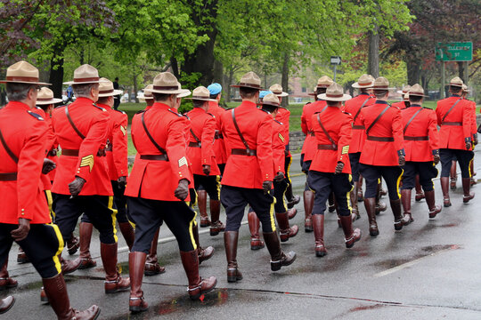 Toronto, Canada -  Police in red RCMP uniforms march in a parade