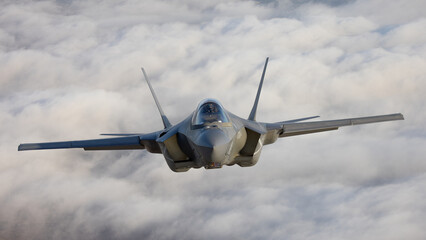 Very  close frontal view of a F-35C Lightning II   over clouds
