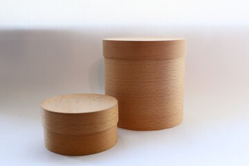 Close-up of wooden tubes, on a white background, wooden boxes, eco-packaging 