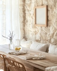 A wooden table with a vase of flowers and a vase of lemons. A picture frame is on the wall