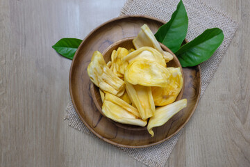 Fresh Ripe Jackfruit Pieces crackers in a Wooden Bowl on Rustic Table