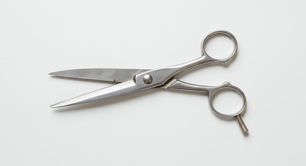 Metal scissors against white background