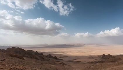 Vast Desert Landscape Under Cloudy Sky, with Rocky Outcrops in Foreground
