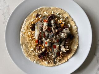 Healthy Mediterranean meal with sardines