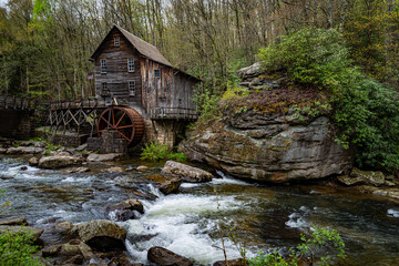 Serene quiet waterfall in the woods of Appalachia Mountains, West Virginia State Park with Old Mill in background © True North Photo