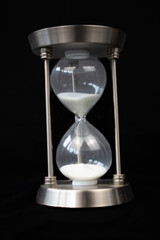hourglass on black background