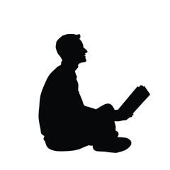 Silhouette of a man reading book