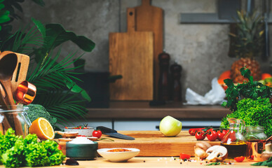 Food background. Healthy eating, cooking, blogging scene. Cutting board with raw onion, vegetables and herbs on cozy kitchen on wooden table, kitchenware and utensils