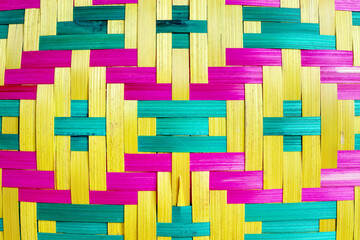 Colorful weaving bamboo wood texture blue pink yellow patterns on background