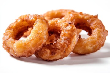 Delicious golden-brown rings of deep-fried dough, showcasing a crispy texture on a white background