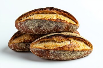 Freshly baked artisanal bread loaves stacked on a white background, perfect for culinary displays