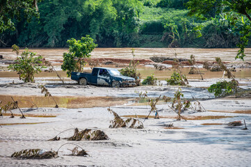 Truck stuck in mud after flooding by Kok river in Chiang Rai province of Thailand.
