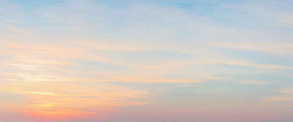 Obraz premium Soft pastel sky with clouds in shades of blue pink and orange. luxurious premium sunset and sunrise photo collection for background