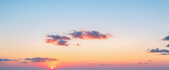 Naklejka premium Sky with clouds at sunset featuring orange pink and blue colors. luxurious premium sunset and sunrise photo collection for background