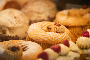 Sweet pastries displayed in a bakery showcasing various designs