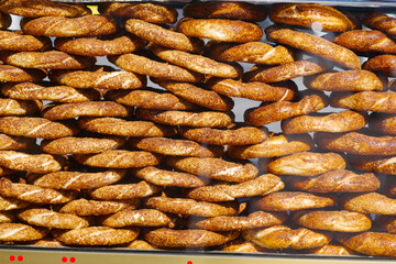 Freshly baked turkish simit arranged in a display case