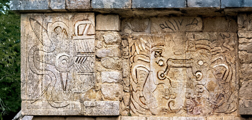 Details of bas-relief carvings on the wall of the  El Templo Kukulcan platform at Mayan Ruins of Chichen Itza, Mexico