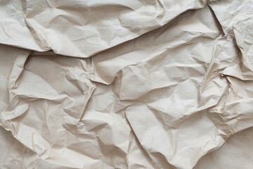 Obraz premium Textured crumpled brown paper for backgrounds and graphic elements