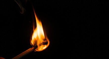 Flickering Flame: A Match Ignited in Darkness