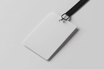 Blank white ID card with black lanyard on white background.