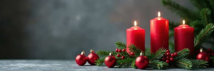 Burning Advent candles amidst festive fir & decor, grey backdrop , hope, detail