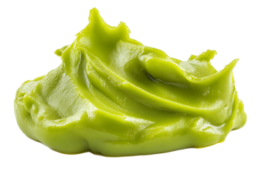 A close up shot of a vibrant green blob of avocado cream against a stark black background in sharp focus