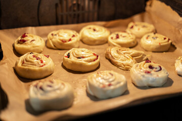 The buns are baking in the oven. Home baking.
