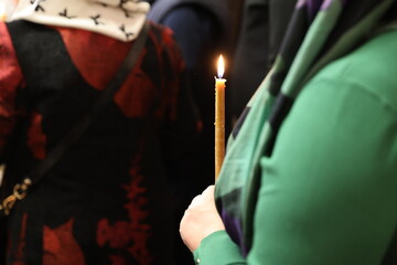 woman holding candle