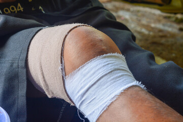 Close up of a bandaged leg after an accident while working in construction